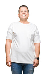 Wall Mural - Middle age arab man wearig white t-shirt over isolated background with a happy and cool smile on face. Lucky person.