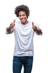 Wall Mural - afro american man over isolated background approving doing positive gesture with hand, thumbs up smi