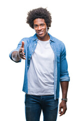 Wall Mural - afro american man over isolated background smiling friendly offering handshake as greeting and welco