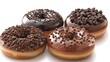 chocolate doughnuts adorned with various chocolate varieties, featuring a clean and smooth chocolate glaze against a pristine white background.