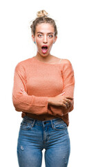 Sticker - Beautiful young blonde woman over isolated background afraid and shocked with surprise expression, fear and excited face.