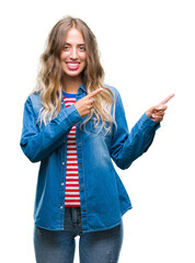 Poster - Beautiful young blonde woman over isolated background smiling and looking at the camera pointing with two hands and fingers to the side.