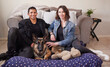 © peopleimages.com - Interracial couple, living room and portrait with dog in new house with rescue and foster pet with smile. Love, care and lounge with people and animal together with loyalty, trust and bonding at home