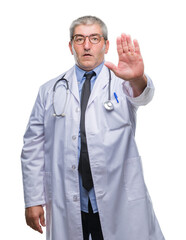 Canvas Print - Handsome senior doctor man over isolated background doing stop sing with palm of the hand. Warning expression with negative and serious gesture on the face.