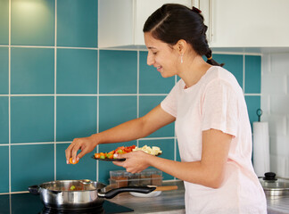 Poster - Cooking, stove and woman in kitchen with vegetables for meal prep for dinner, supper and lunch. Recipe, frying and happy person with ingredients in pan for wellness, nutrition and healthy eating