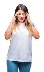 Wall Mural - Young beautiful woman casual white t-shirt over isolated background with hand on head for pain in head because stress. Suffering migraine.