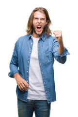 Sticker - Young handsome man with long hair over isolated background angry and mad raising fist frustrated and furious while shouting with anger. Rage and aggressive concept.