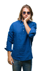 Sticker - Young handsome man with long hair wearing sunglasses over isolated background thinking looking tired and bored with depression problems with crossed arms.