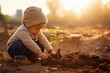 © shelbys - A Young Child Planting a Tree