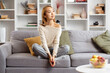 Young Woman Relaxing On Sofa In Modern Living Room, Peaceful, Comfortable, Stylish Interior, Casual Wear, Daydreaming, Home Decor
