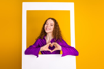 Poster - Photo of lovely young lady instant photo frame show heart gesture dressed stylish violet garment isolated on yellow color background