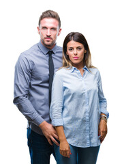 Sticker - Young workers business couple over isolated background with serious expression on face. Simple and natural looking at the camera.