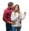 © Krakenimages.com - Young couple in love wearing winter sweater over isolated background smiling and looking at the camera pointing with two hands and fingers to the side.