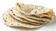 A stack of tortillas with a white background. The tortillas are all different sizes and are piled on top of each other