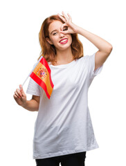 Wall Mural - Young beautiful woman holding flag of spain over isolated background with happy face smiling doing ok sign with hand on eye looking through fingers