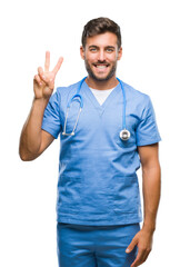 Wall Mural - Young handsome doctor surgeon man over isolated background showing and pointing up with fingers number two while smiling confident and happy.