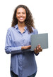 © Krakenimages.com - Young hispanic woman holding computer laptop with a happy face standing and smiling with a confident smile showing teeth