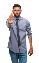 Wall Mural - Adult hispanic business man over isolated background doing stop sing with palm of the hand. Warning expression with negative and serious gesture on the face.