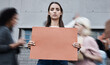© peopleimages.com - Woman, portrait and blank protest banner in busy city for change of government, politics and mockup space. Future, sign and group at rally outdoor for fight, human rights and revolution in Israel