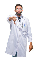 Wall Mural - Adult hispanic doctor man over isolated background looking unhappy and angry showing rejection and negative with thumbs down gesture. Bad expression.