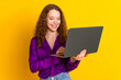 © deagreez - Photo portrait of pretty young girl hold netbook wear trendy violet outfit isolated on yellow color background