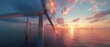 The off-shore windmill park is generating electricity in the ocean, generating clean, sustainable green energy for cities. The sunset is beautiful and the wind turbines are working in the ocean.