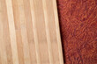 Wooden cutting board on brown paper abstract background. Top view.