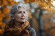 Portrait of a beautiful middle-aged woman with short gray hair in an orange jacket on the street.. Beautiful simple AI generated image in 4K, unique.
