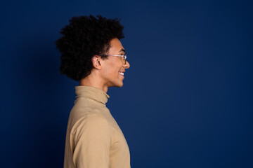 Poster - Photo portrait of attractive young man profile look empty space dressed stylish beige clothes isolated on dark blue color background