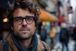 Reflective urban portrait of a pensive man with disheveled hair and glasses in a busy city setting, showcasing candid moments of city life