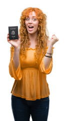 Poster - Young redhead woman holding passport of United States of America screaming proud and celebrating victory and success very excited, cheering emotion