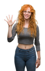 Wall Mural - Young redhead woman showing and pointing up with fingers number five while smiling confident and happy.