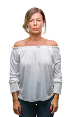 Wall Mural - middle age senior hispanic woman over isolated background with serious expression on face. simple an