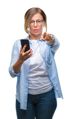 Wall Mural - middle age senior woman texting sending message using smartphone over isolated background pointing w
