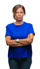 Wall Mural - middle age senior hispanic woman over isolated background with serious expression on face. simple an