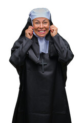 Sticker - Middle age senior christian catholic nun woman over isolated background covering ears with fingers with annoyed expression for the noise of loud music. Deaf concept.