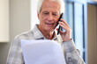 © peopleimages.com - Elderly, man and phone, paperwork or retirement, finance budget and mortgage, bills and taxes, reading and account for home loan. Senior, person and talk, document or notice of insurance fees