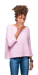 Wall Mural - Beautiful young african american woman wearing glasses over isolated background bored yawning tired covering mouth with hand. Restless and sleepiness.