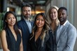 © WMSTUDIO - A group of people are posing for a photo in a business setting