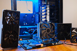 Fototapeta  - Modern computer parts with PC case on background. Building personal gaming and workstation pc concept. hardware components and system unit. 