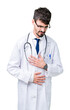 © Krakenimages.com - Young doctor man wearing hospital coat over isolated background with hand on stomach because nausea, painful disease feeling unwell. Ache concept.