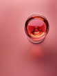 topview of red wine glass on red surface