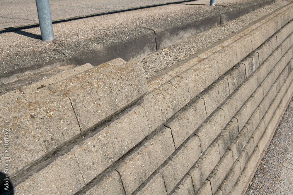 dry stone walls, construction detail of prefabricated walls in gravity concrete blocks, retaining wall in concrete blocks.