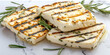 Grilled Halloumi Cheese on a white marble background, Minimalistic composition.