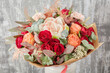 Small Beautiful bouquet of mixed flowers in woman hand. Floral shop concept . Beautiful fresh cut bouquet. Flowers delivery