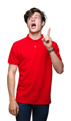Sticker - Young handsome man wearing red t-shirt over isolated background pointing finger up with successful idea. Exited and happy. Number one.