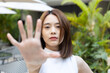 Halt, Stop it, Asian Woman Expressing Refusal, showing Stop Hand Sign to Communicate Prohibition and Rejection