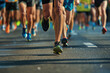 Marathon running in the light of evening,running on city road detail on legs.