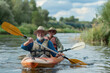 Senior couple kayaking on the river. Healthy elders enjoying summer day outdoors. Sportive people having fun at the nature. Active retirement concept