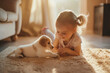 Adorable little girl playing with pet puppy at home